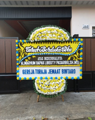 Papan Bunga Duka di Karya
